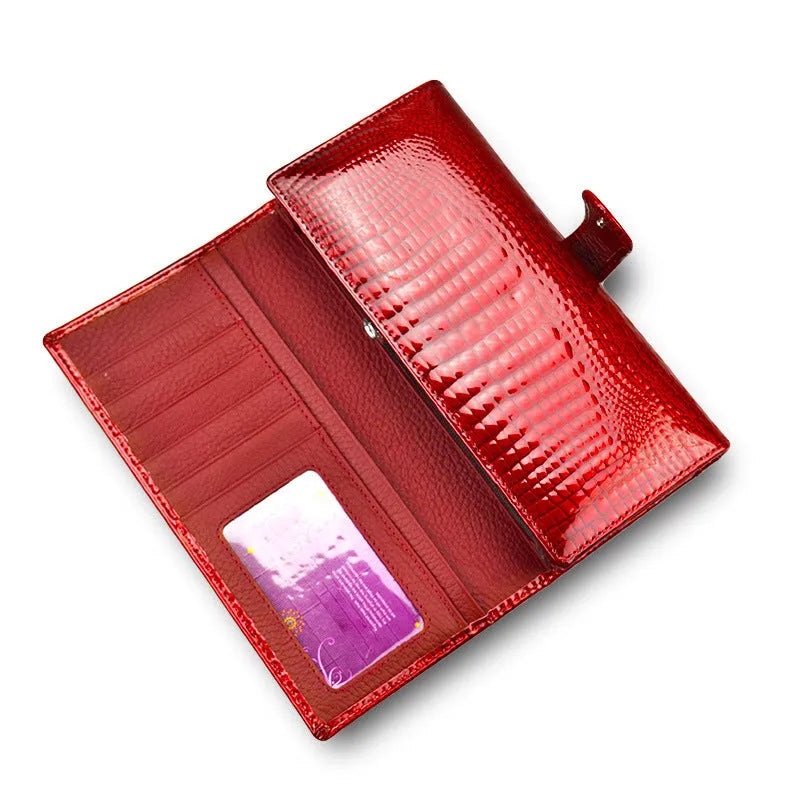 Women's patent leather coin purse with crocodile pattern in wine red colour showing pigskin lining