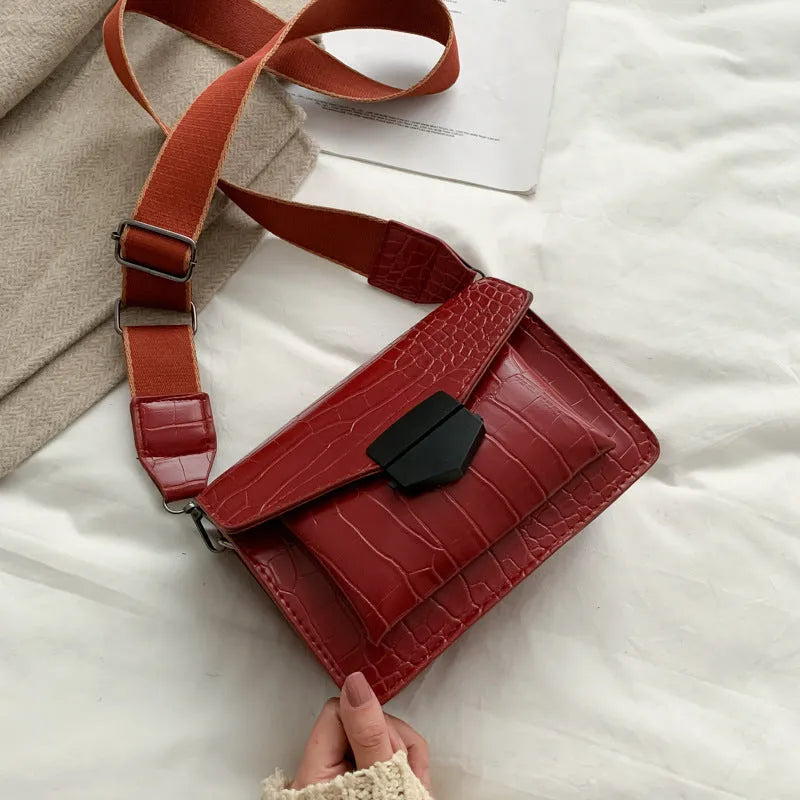 Vintage PU leather crossbody bag in black showing 20cm width and crossbody strap