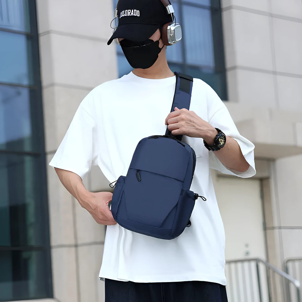 Men's waterproof chest bag in grey showing dimensions and shoulder strap