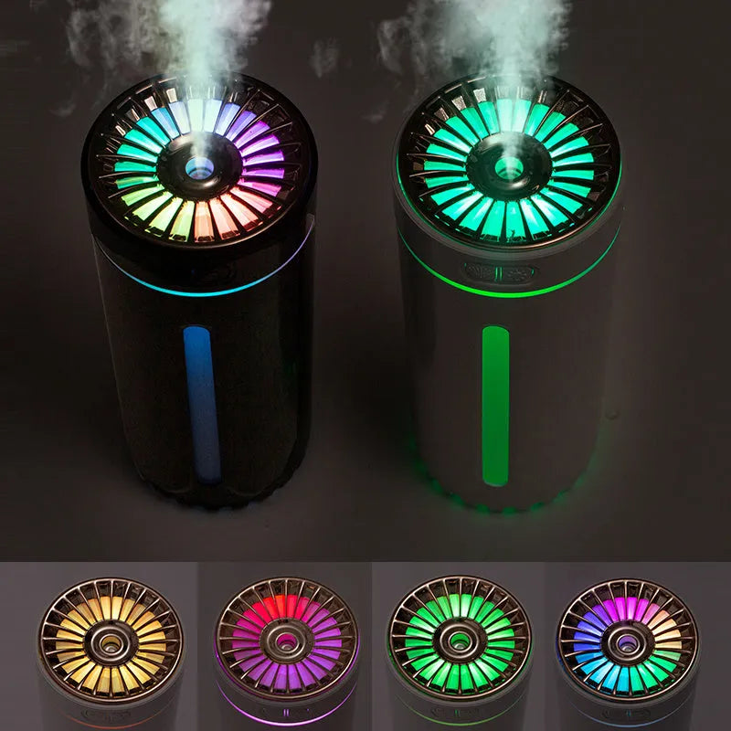 Black portable car humidifier with colourful LED lights on car cup holder showing mist output