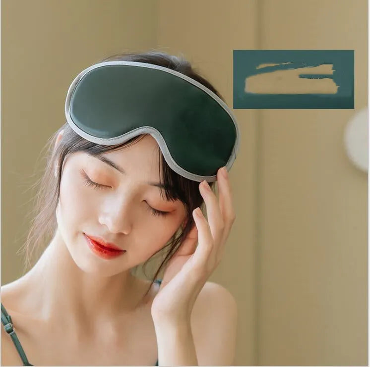 Pink and green portable heated eye mask with USB charging and vibration features for home and office use