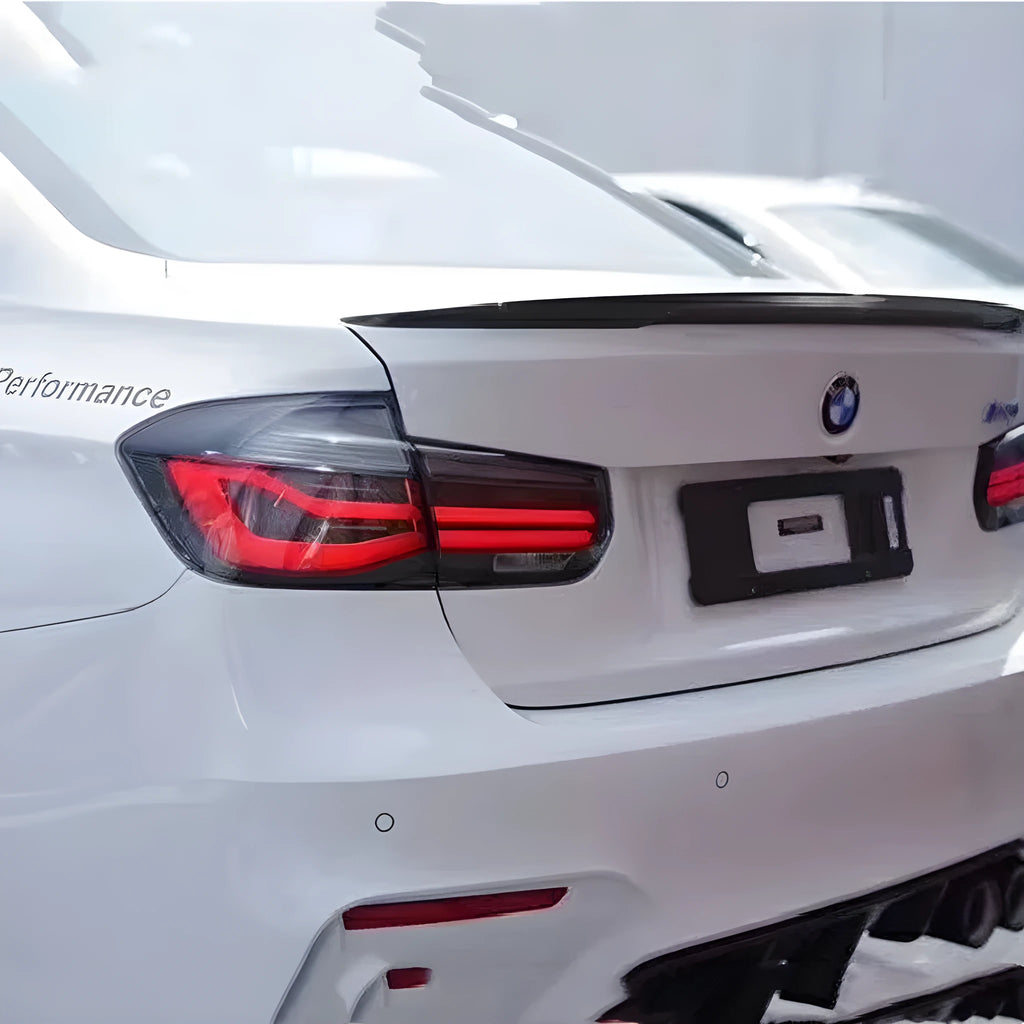BMW 3 Series red and smoked black LED tail light assembly with streamer indicators