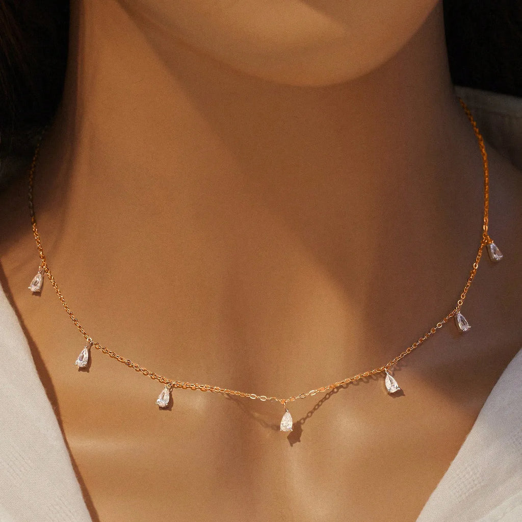 Sterling silver necklace with drop-shaped artificial zircon pendant on adjustable chain in silver, rose gold, and golden yellow finishes