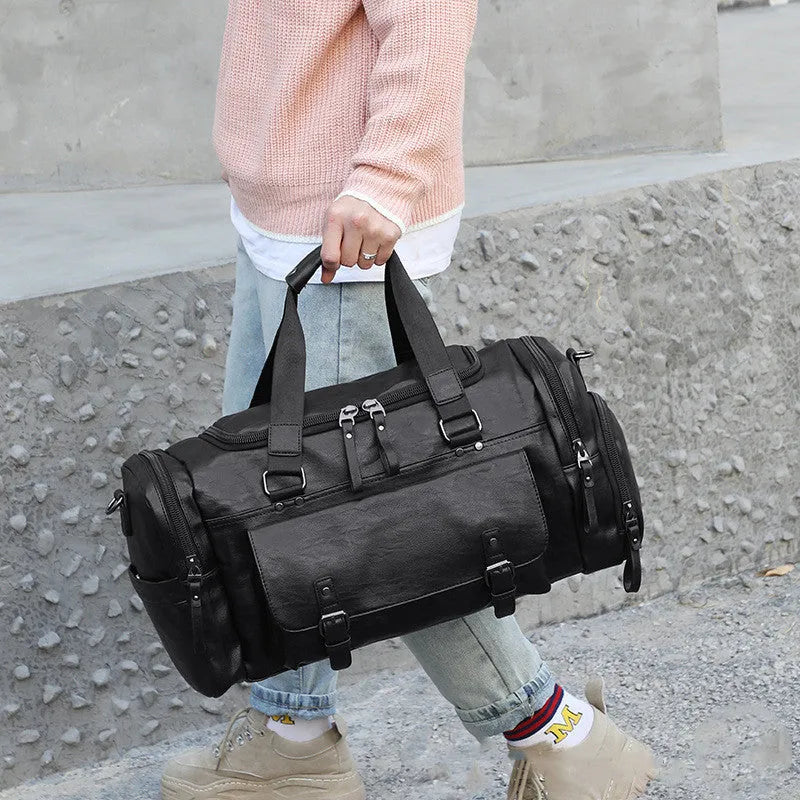 Black travel shoe bag with large 52cm capacity and separate compartment for footwear.