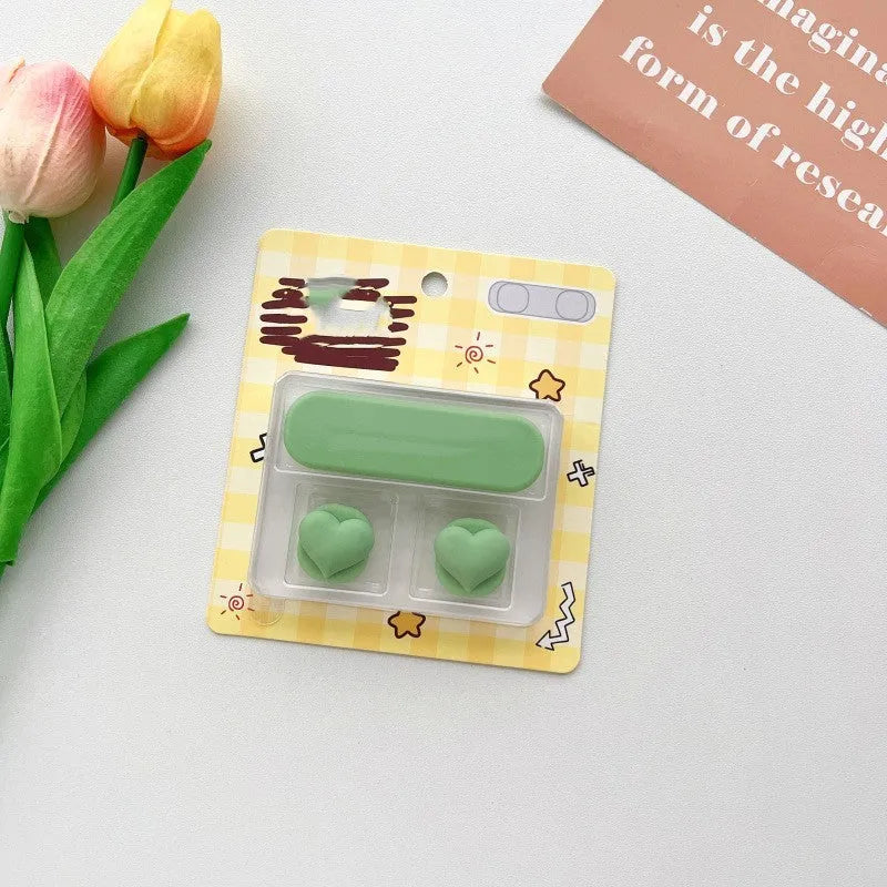 Plastic desktop clip for organising a magnetic hub charging cable, shown in one of ten colour variations.