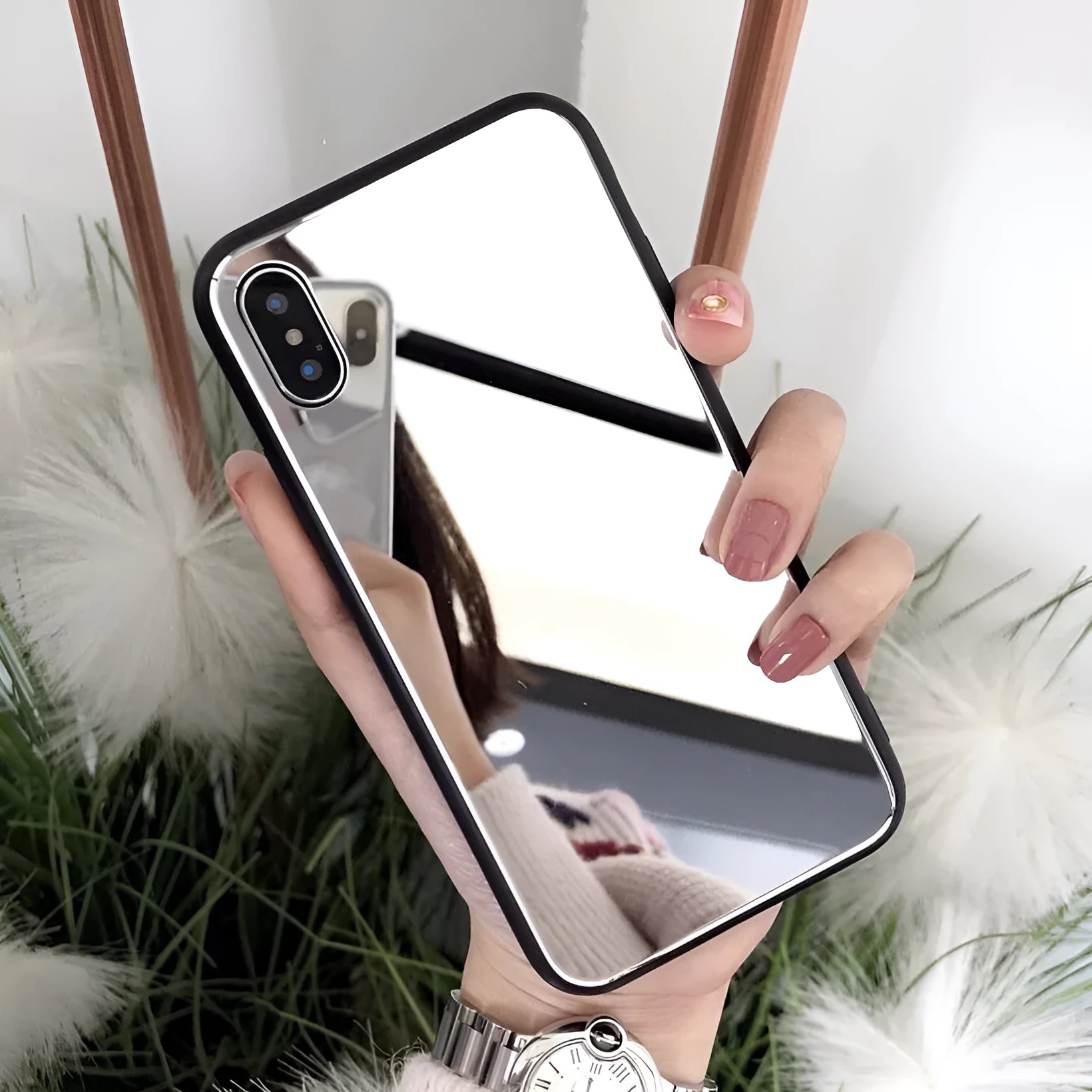 Black iPhone case with a reflective mirror surface on the back, compatible with iPhone X, 7, and 8 Plus.