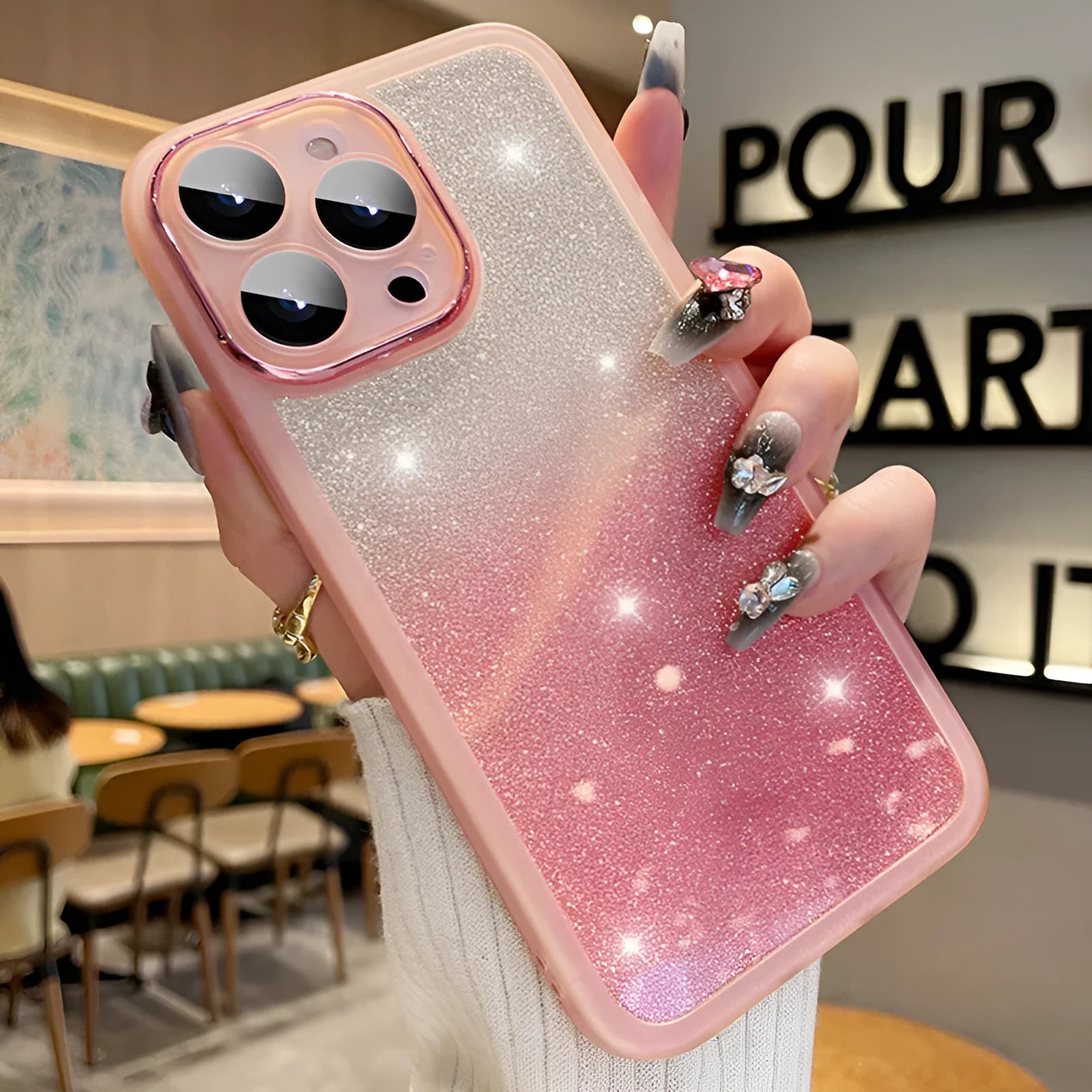 Ultra-thin transparent glitter gradient iPhone case with magnetic suction on a phone.