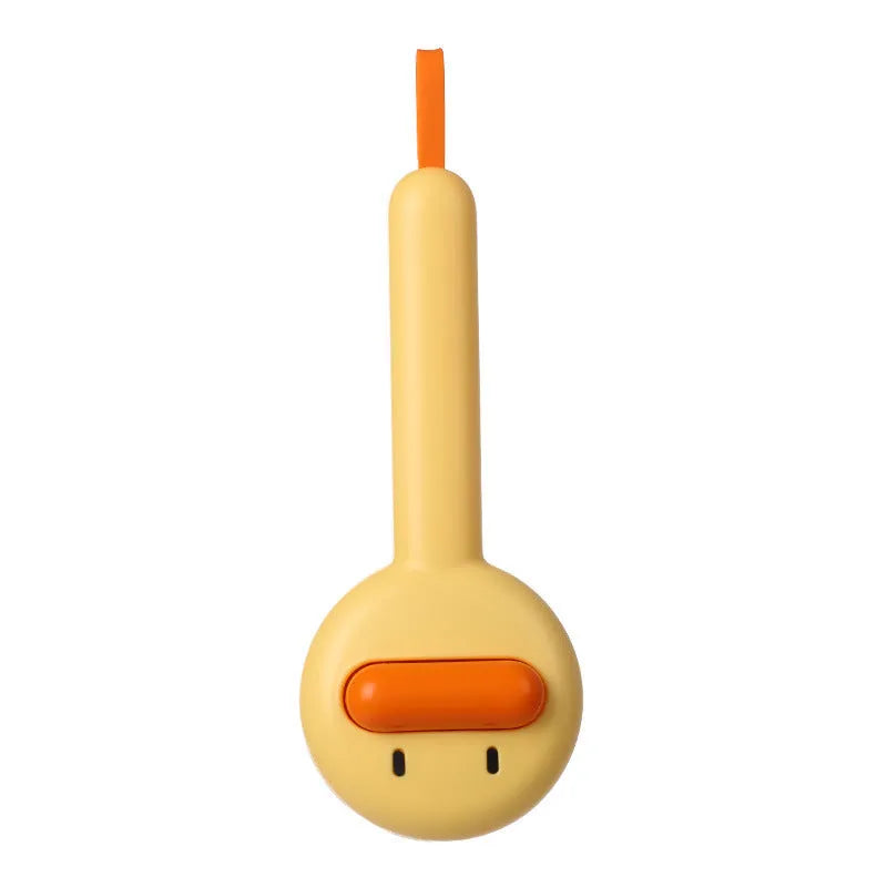 Small yellow duck-shaped pet grooming comb with open sections and needle bristles