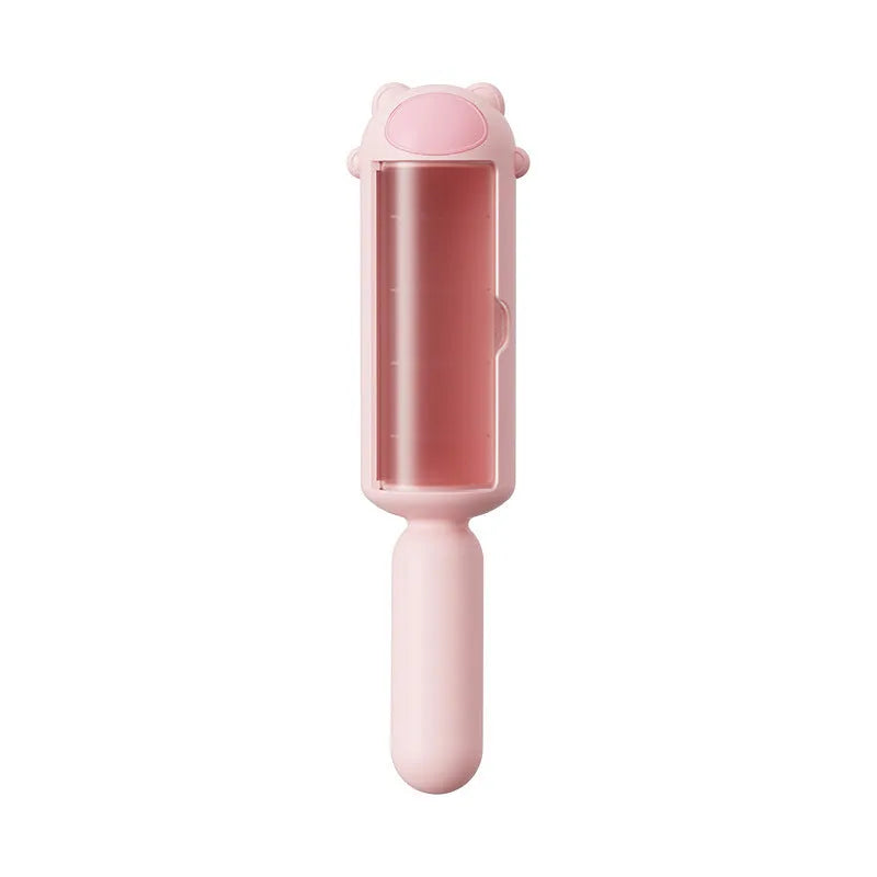 Blue reusable pet hair remover tool with a roller and self-cleaning base.