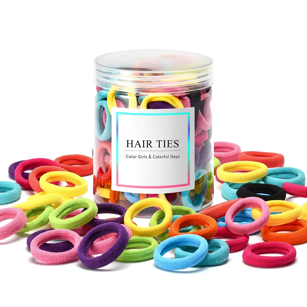 100 seamless cotton baby hair ties in 10 colours stored in a small glass jar.