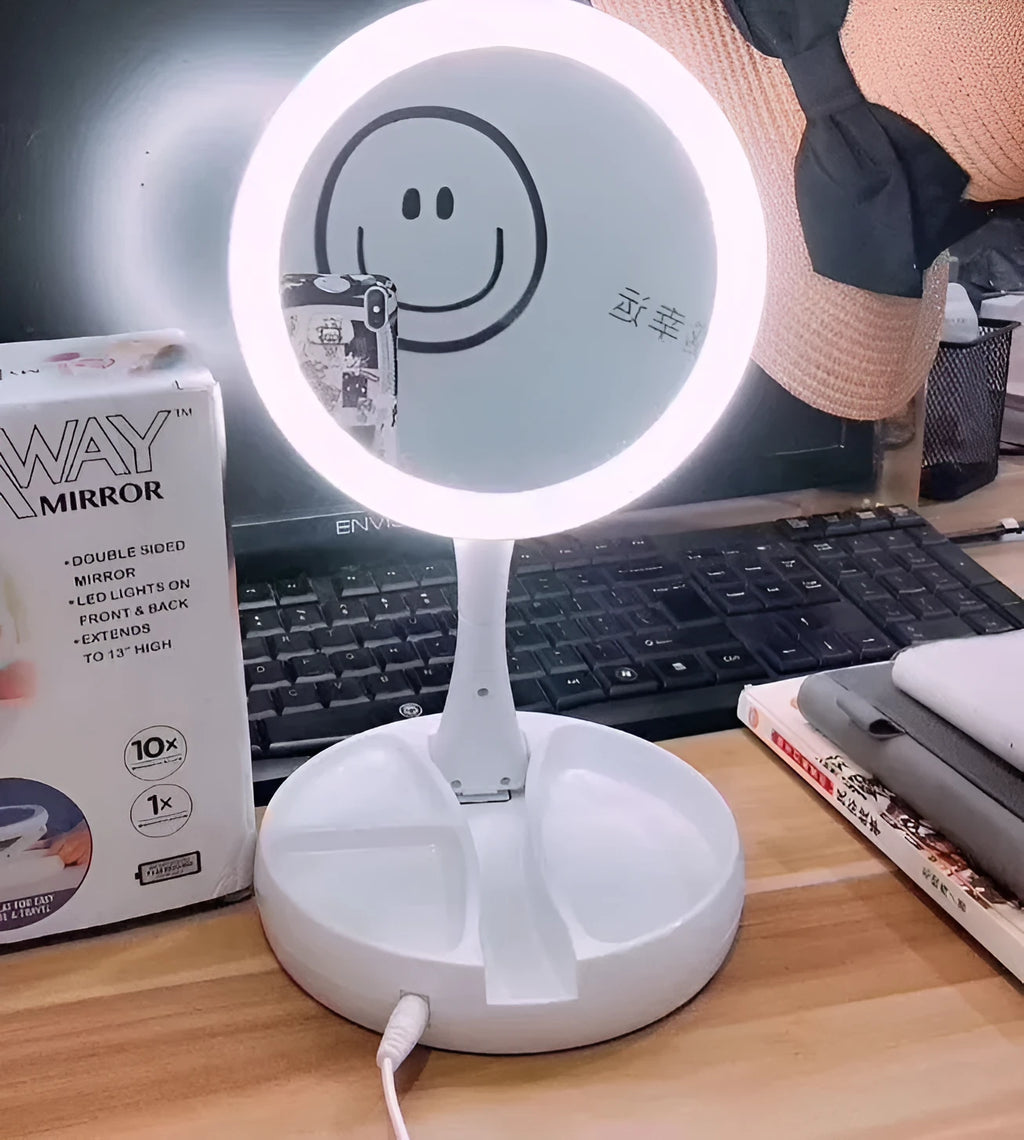 White acrylic double-sided vanity mirror with LED lights and a foldable stand.