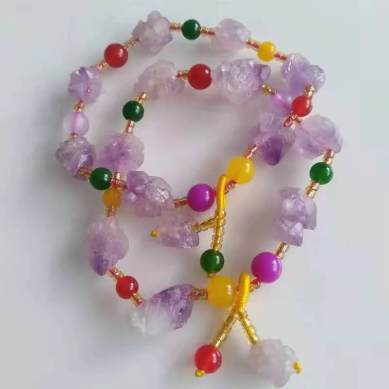 Natural shaped purple amethyst bead bracelet for women with a fu charm.
