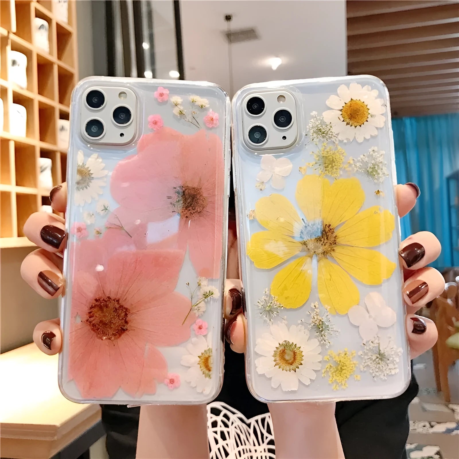 Pink and yellow floral design TPU back cover case for iPhone on a white background.