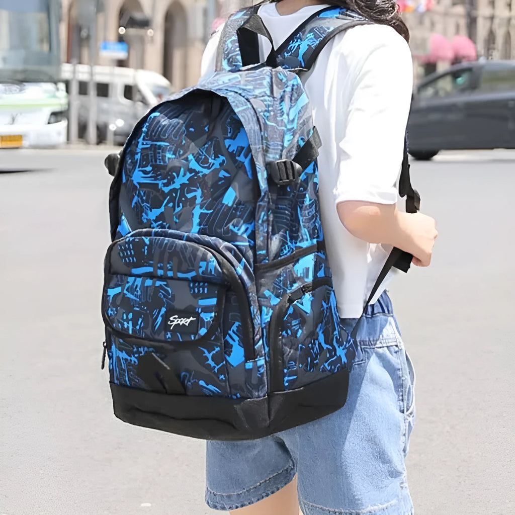 Blue and red classic nylon backpack showing large main compartment for school or travel.