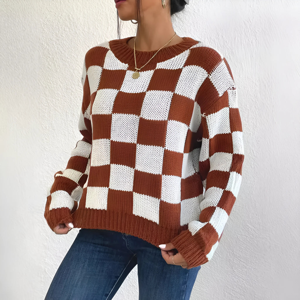 Dark brown loose plaid pullover sweater with long sleeves and a round neck.