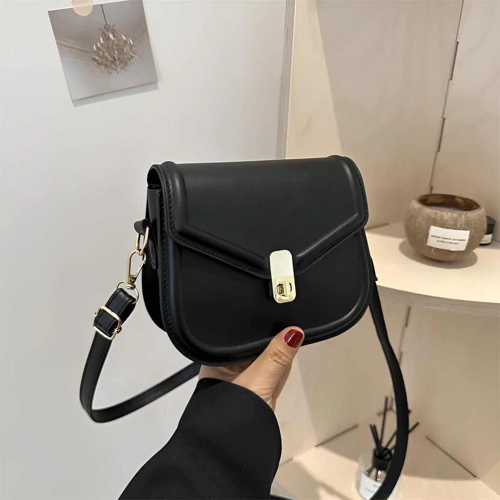 Soft niche texture PU messenger bag in horizontal square clamshell design shown in black colour.