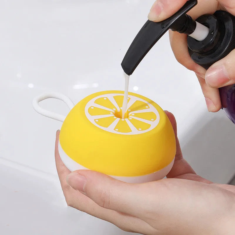Yellow silicone pet bath brush with 3D massage head and combed hair attachment for dog and cat grooming