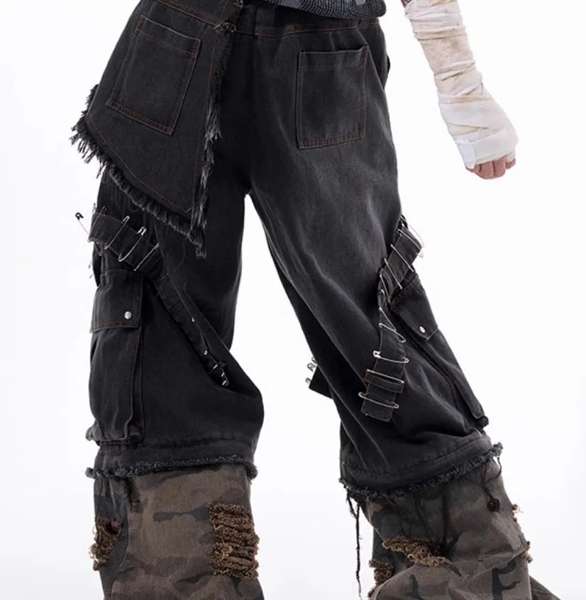 Men's grey jeans with camouflage print panels and ribbed texture panels on the legs.