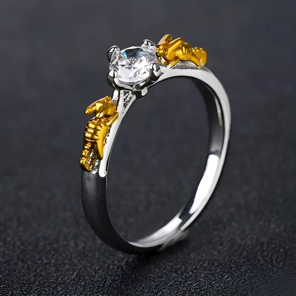 Black gold copper crown crystal ring for cosplay on a grey background.