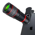 20x magnification smartphone telescope lens with universal mounting clip and eyecup mask on a table.