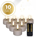 Four taupe-coloured LED tealight candles with 3D flame effect showing flickering warm white glow