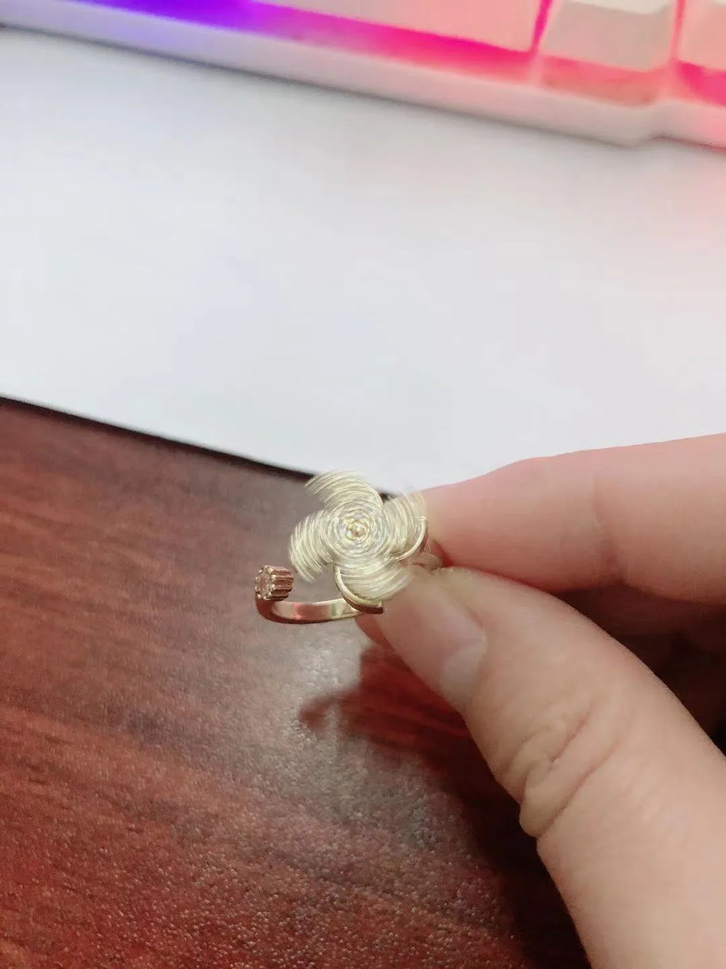 Geometric rotating ring with micro inlaid details in gold or silver electroplated finish