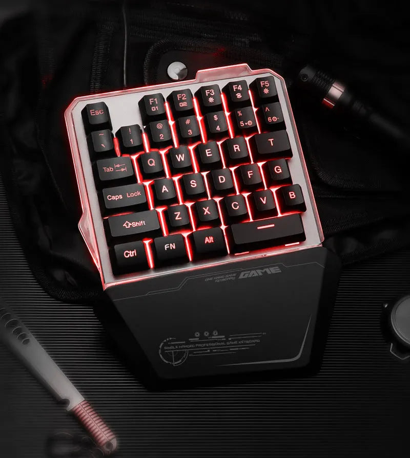 Black G40 one-handed mechanical keyboard with RGB backlighting on a desk.