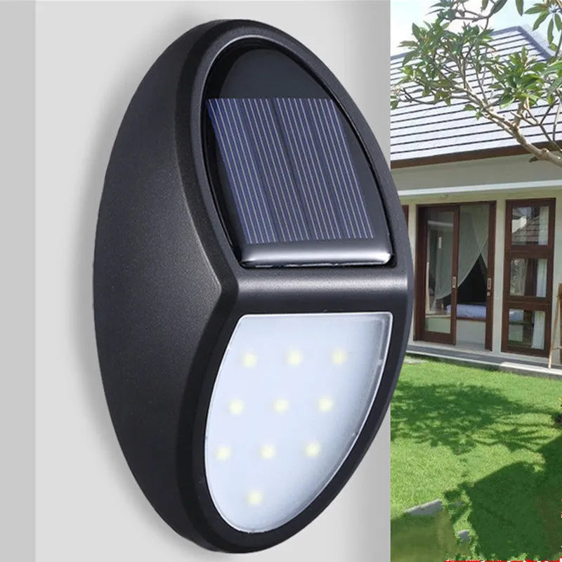 Black solar-powered LED wall light with solar panel and motion sensor