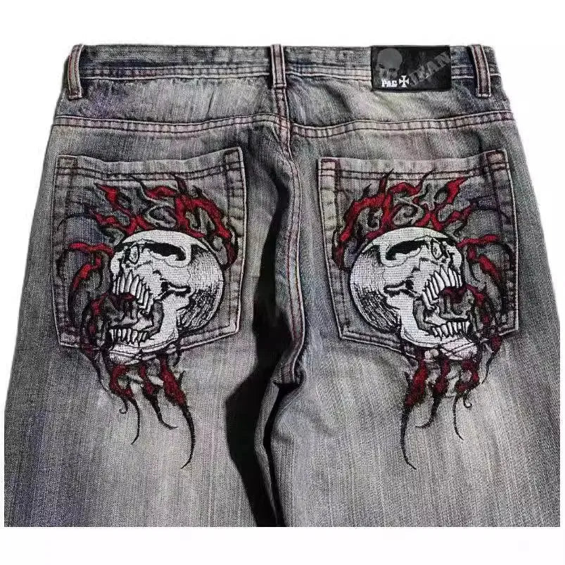 Grey washed-out men's wide-leg straight jeans with a mid-waist and zipper fly.