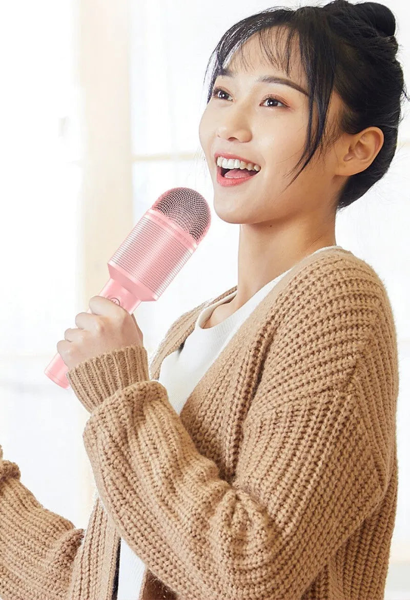 Wireless Bluetooth karaoke microphone in pink, blue, and green colours with USB connectivity