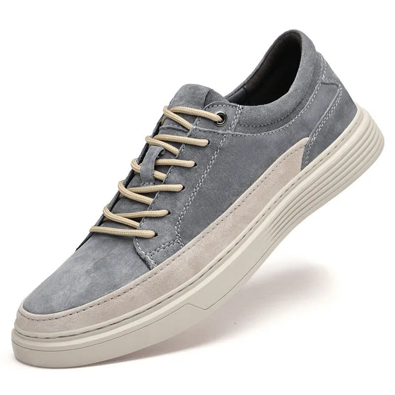 Men's grey casual leather skate shoes with round toe and low-top design on a rubber sole.