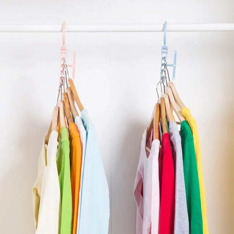 Blue revolving plastic wardrobe hanger with five hooks and a central handle for rotating.