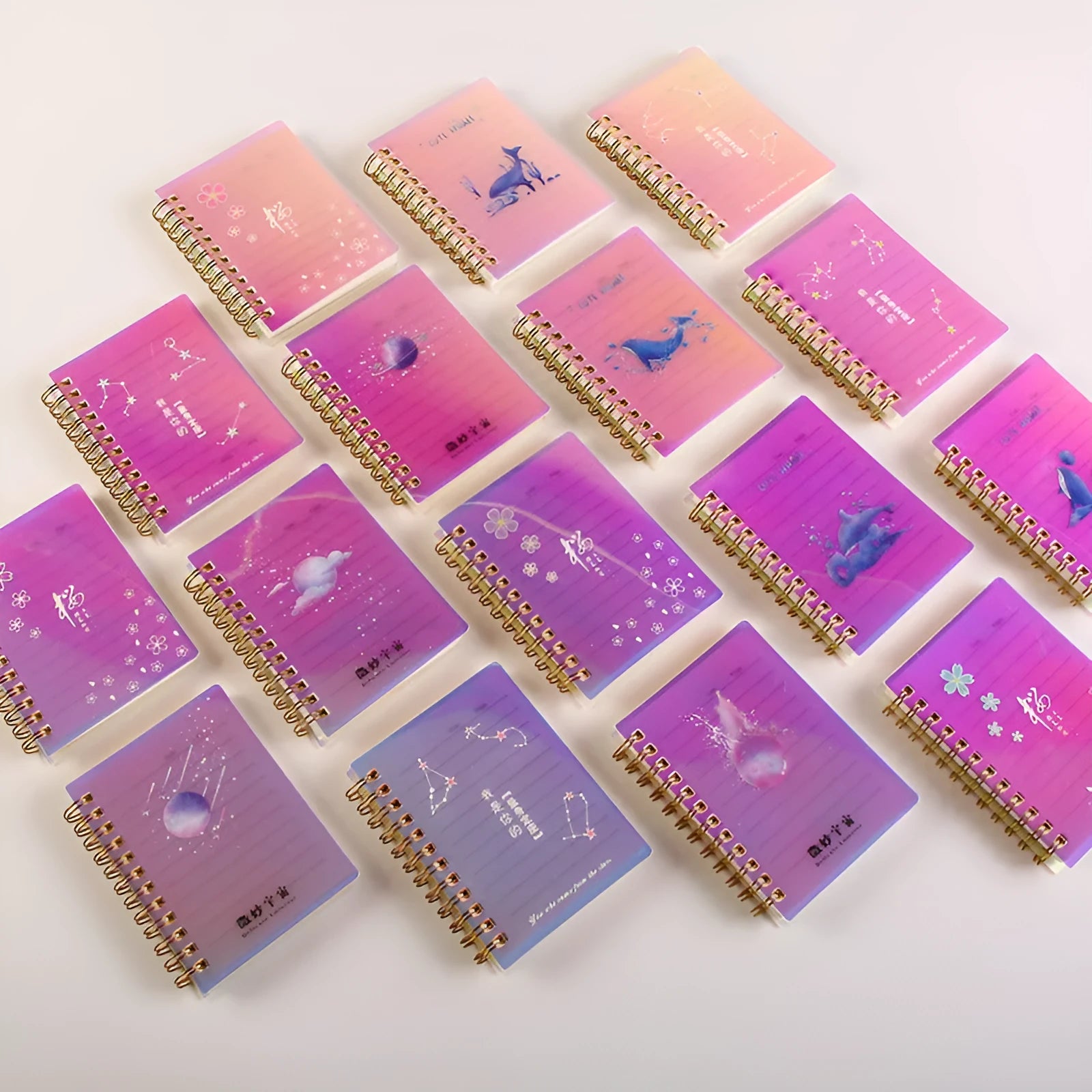 Spiral bound A7 pocket notepad with PP cover shown in Constellation, Sakura, Universe, and Ocean design options.