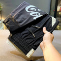 Men's solid black ultra-thin ice silk ankle banded cropped casual trousers