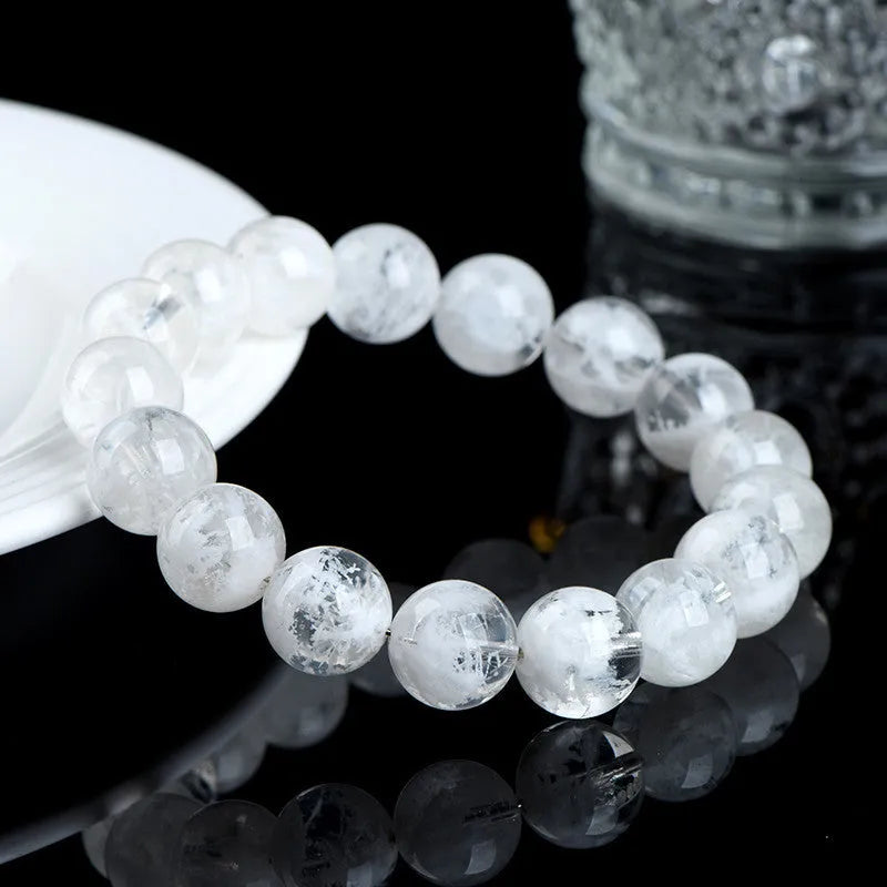 Women's crystal bracelet with natural blizzard snowflake beads featuring Ruyi and Xiangyun Chinese symbols