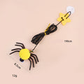 Cat hanging door toy with elastic rope, feather, bell and spider attachment on a white door.