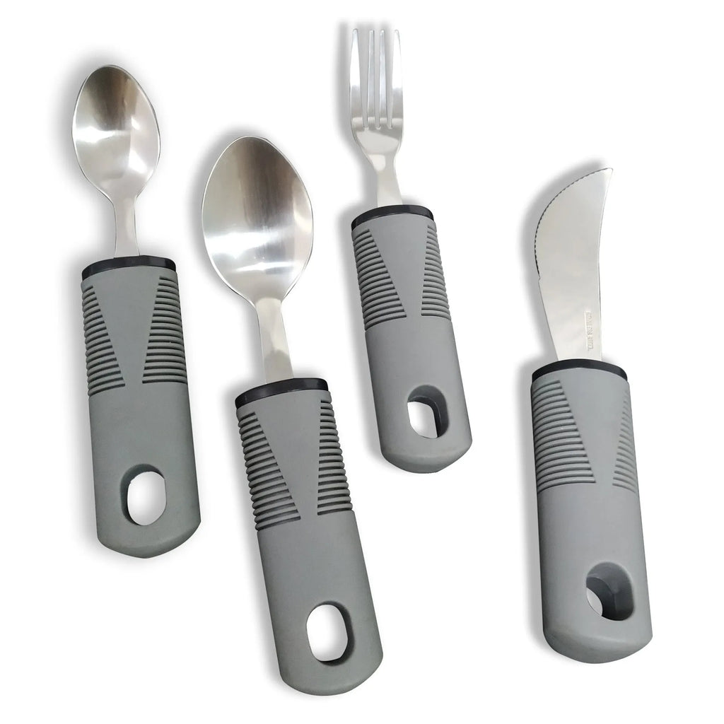 Stainless steel adaptive spoon and spork set with black rubber handle on a table.