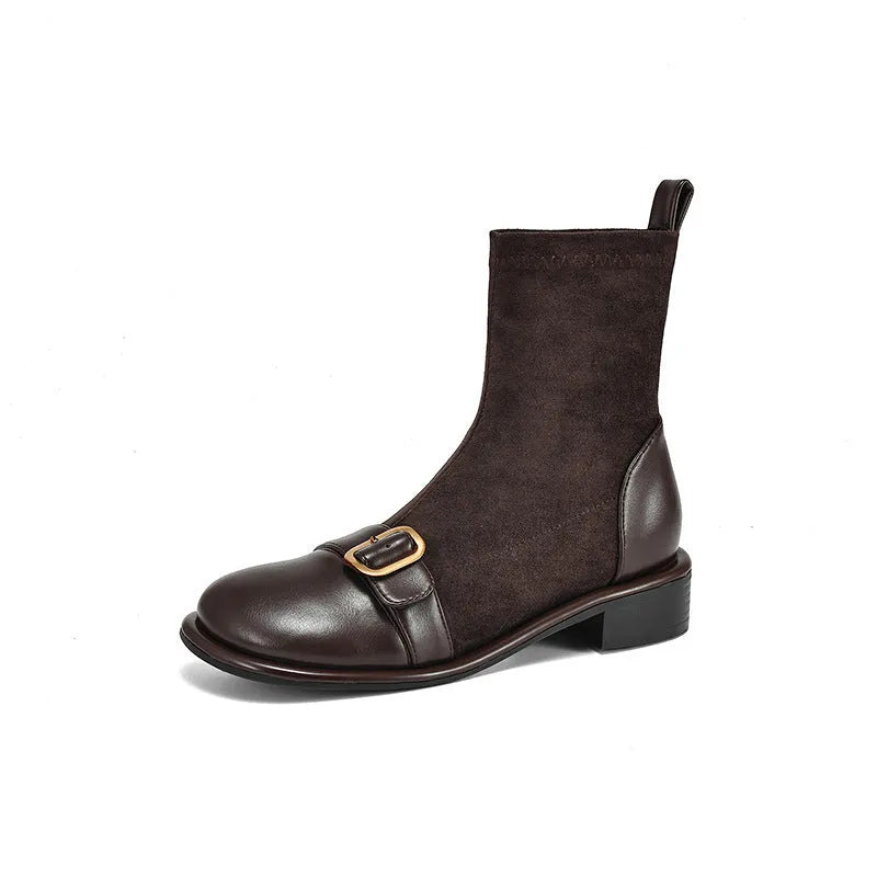 Women's black low heel Martin boots with buckle stitching and front lace-up fastening on a round toe.