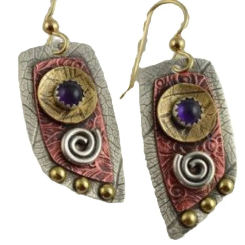 Gold metal earrings with camouflage leopard print pattern on irregular geometric shapes