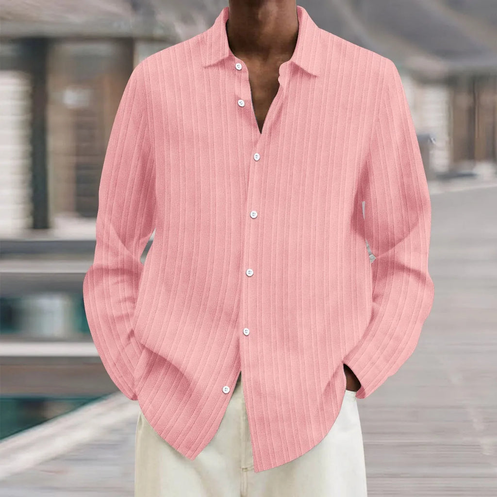 Man wearing a loose-fit, striped, long-sleeve cardigan in a blue colour variant