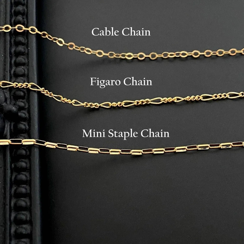 Stainless steel ghost pendant necklace with electroplated titanium steel centrepiece on twisted chain