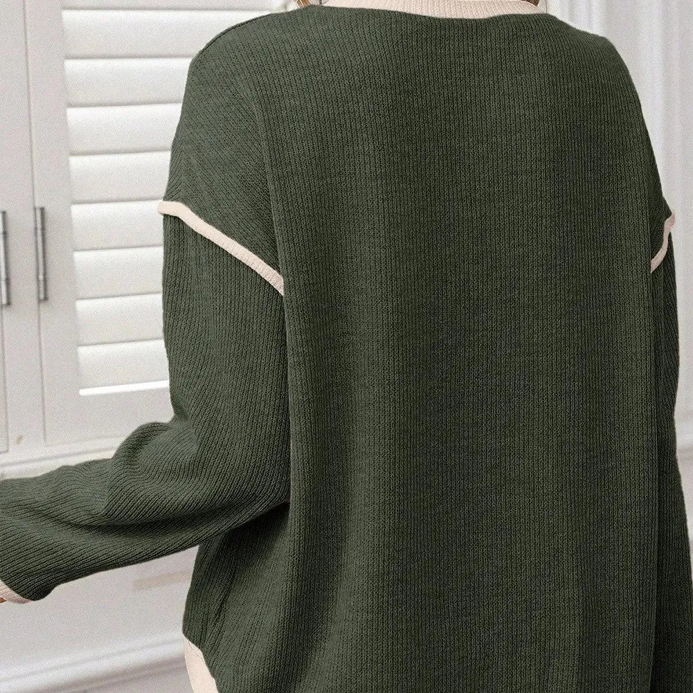 Women's beige knit top with Four Leaf Clover design, drop shoulders, and contrast trim.