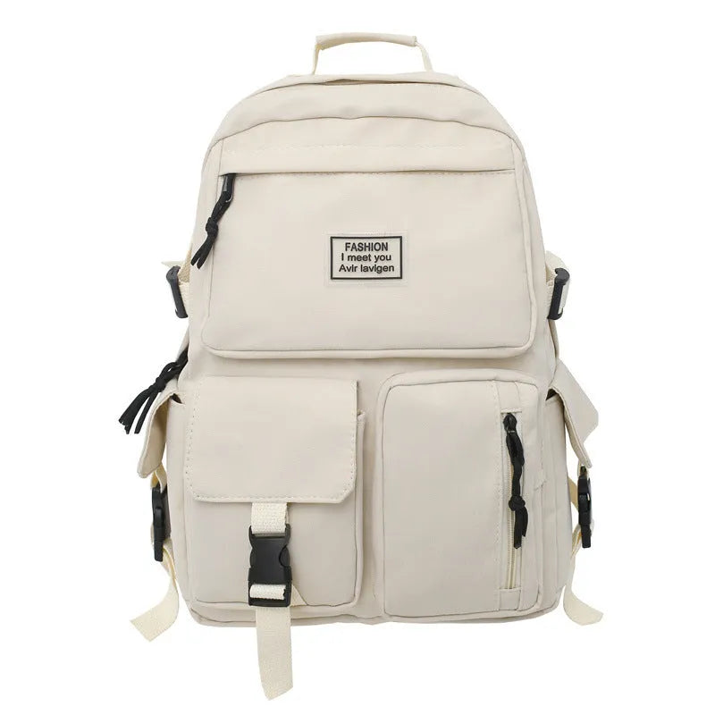 Black and white nylon student backpack with laptop compartment and three-dimensional outer pockets.