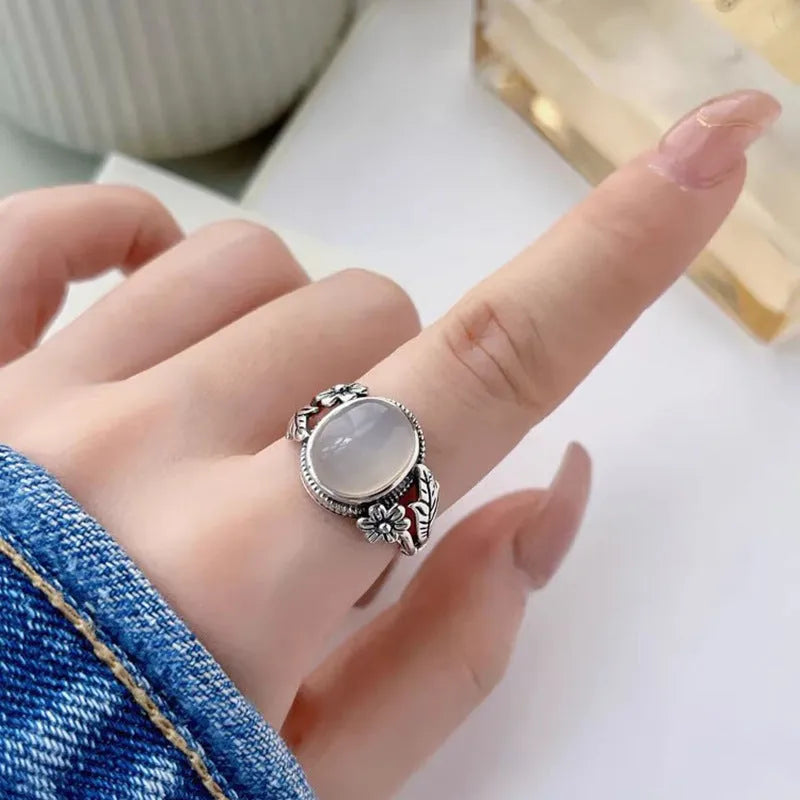 Adjustable copper vintage ring with white chalcedony stone and open mouth design