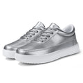 Women's gold leather lace-up casual flat shoes on a white background, showing front and side views.