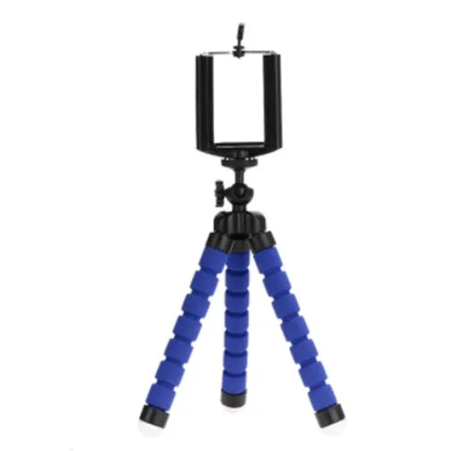 Black flexible octopus tripod with bent legs holding a smartphone mount on a wooden table.