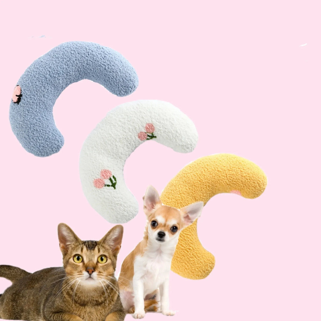 Plush U-shaped pet pillow for small cats and dogs in blue, showing quilted faux fur texture.