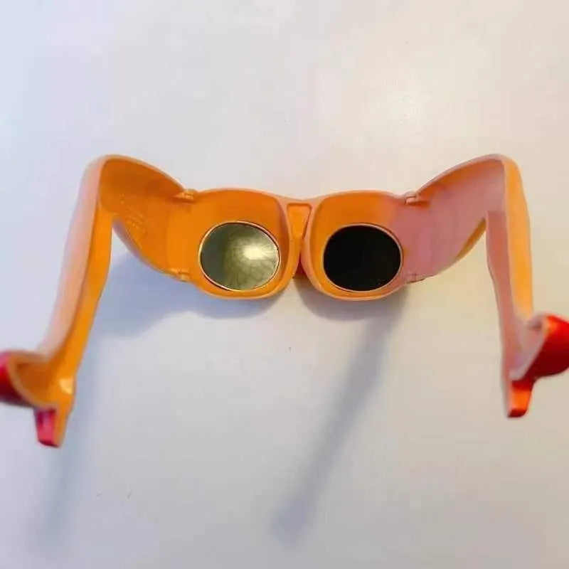 Orange plastic novelty sunglasses with oversized personality leg and hip design on the frame.