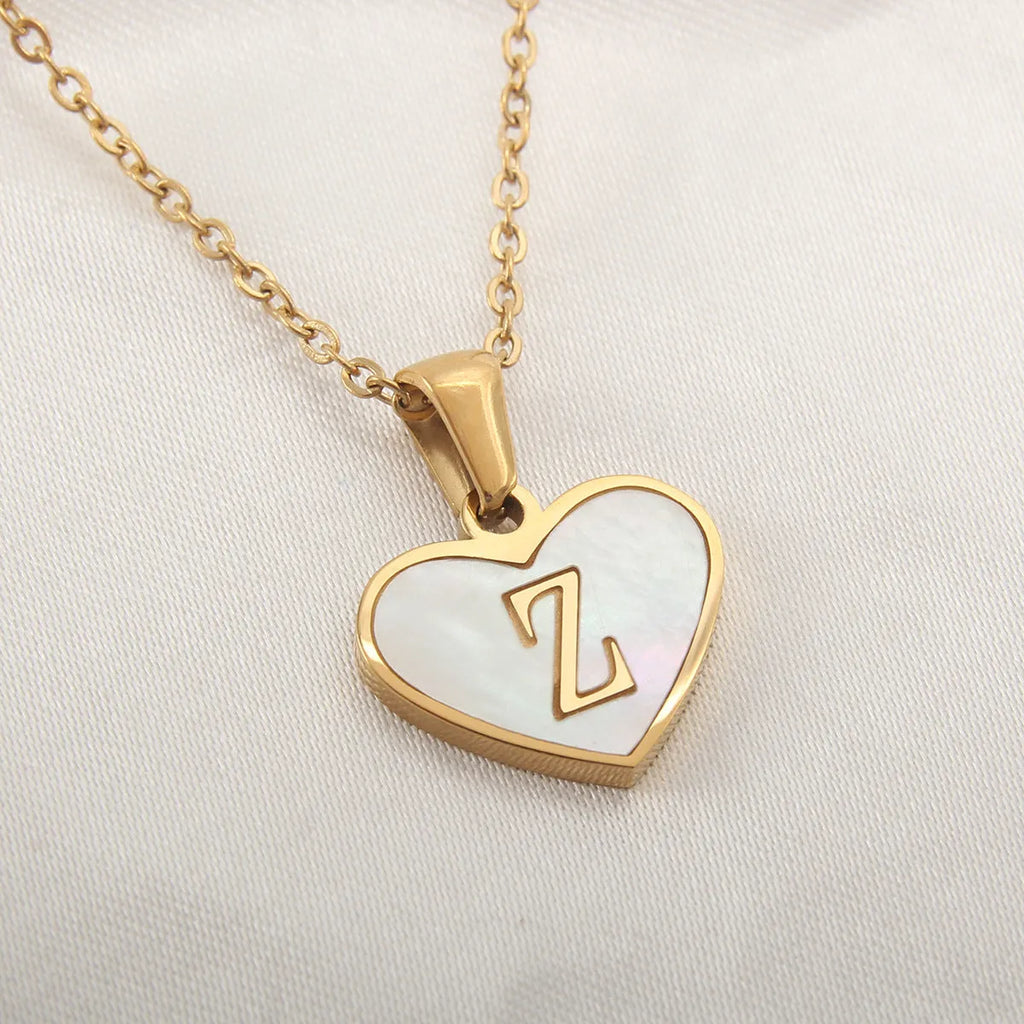 Gold plated heart necklace with white shell centre on a 45+5cm chain