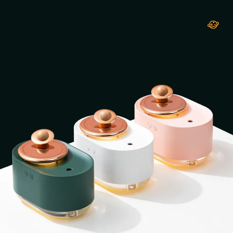 Planet-shaped rotating humidifier with night light in green, pink or white colours showing USB charging port